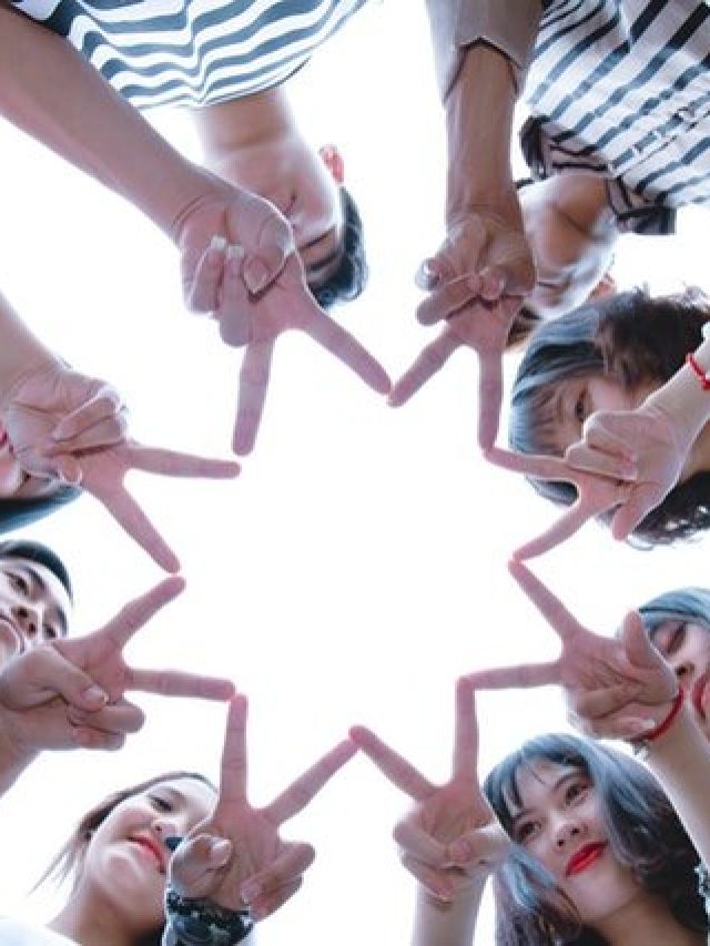 cropped-group-of-people-forming-star-using-their-hands-1116302.jpg